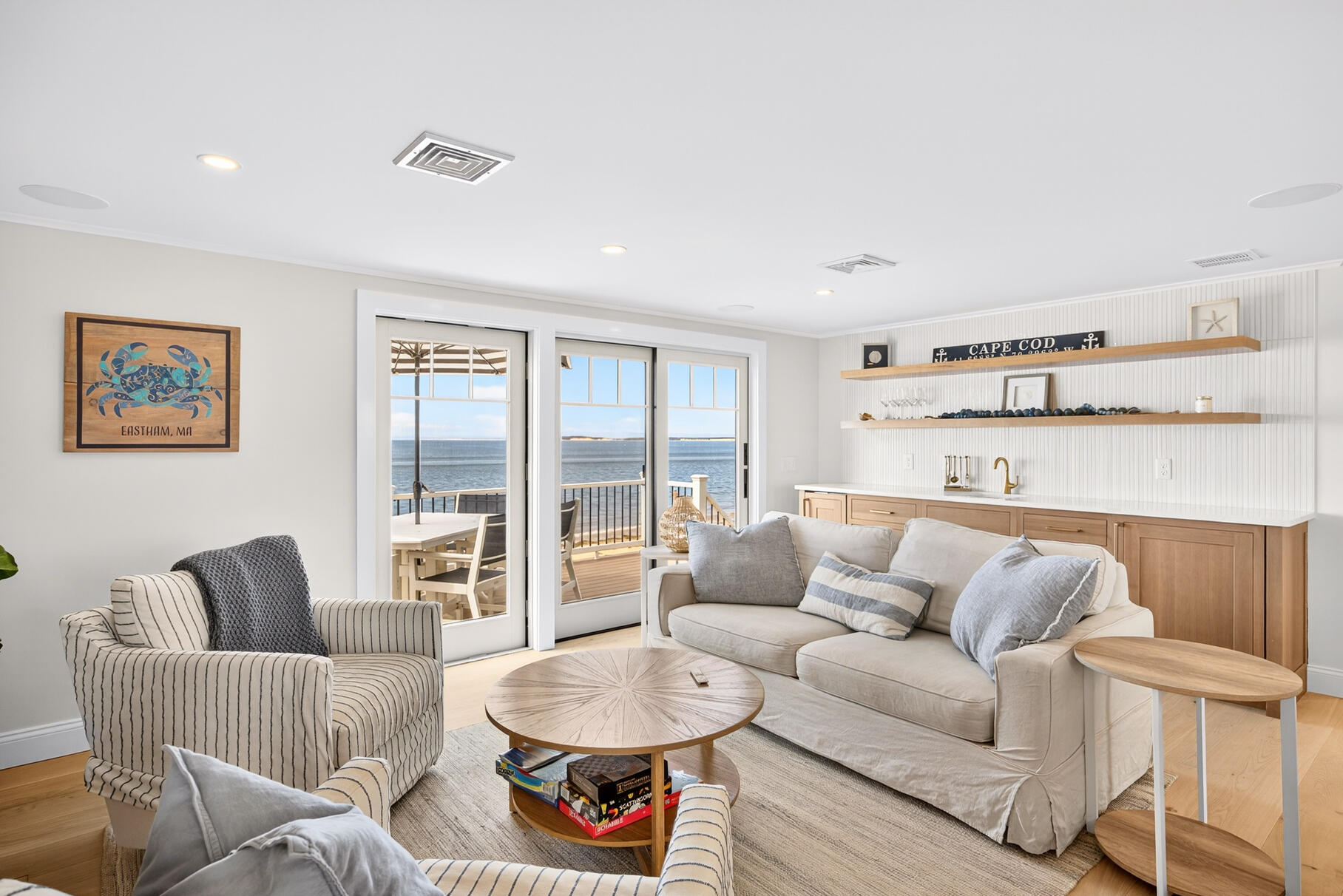 65 Harmes Way Eastham, MA 02642 - Photo 6 of 35 a living room with furniture and a large window