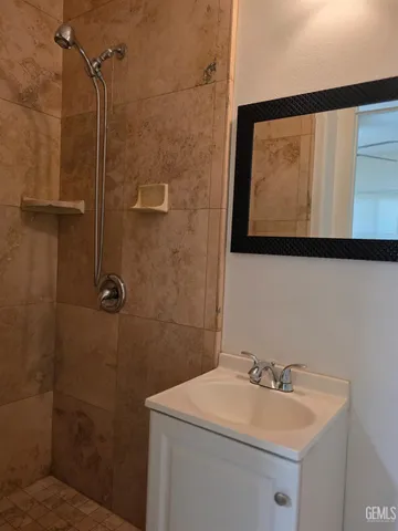 a bathroom with a sink and mirror