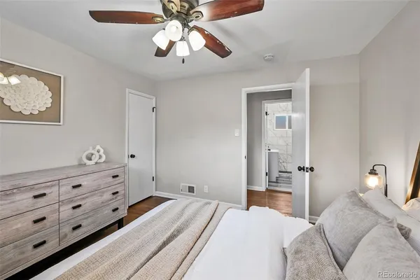 a bedroom with a bed and a dresser
