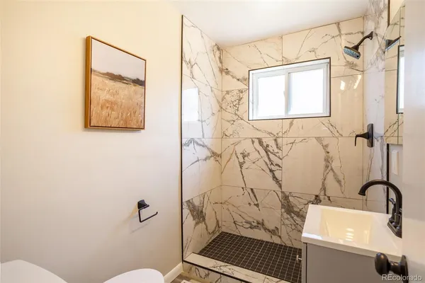 a bathroom with a toilet and sink