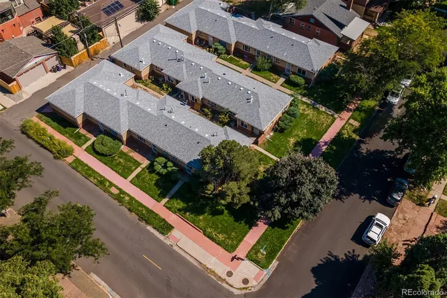 an aerial view of house with a street view