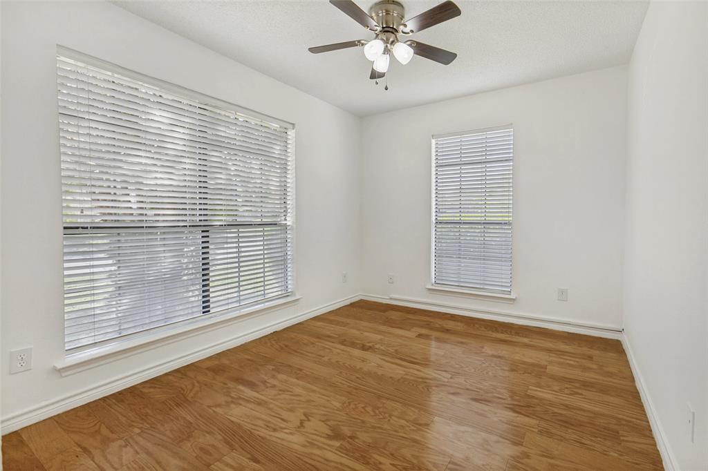 703 Rams Court Richardson, TX 75081 - Photo 12 of 23 Downstairs bedroom which could be used for an office.
