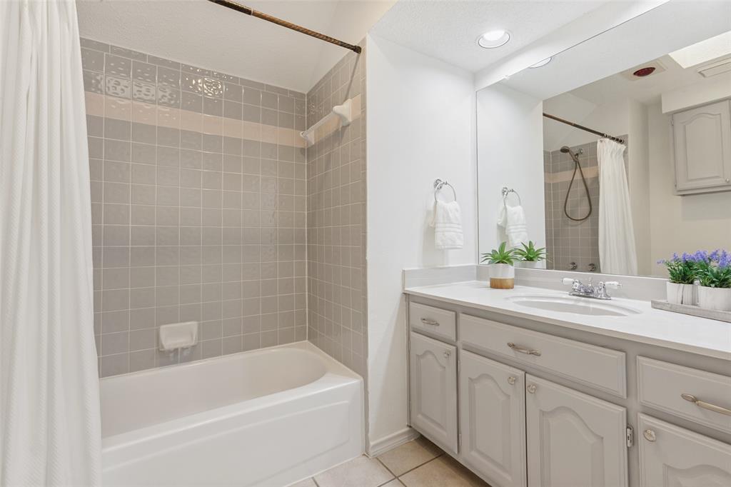 703 Rams Court Richardson, TX 75081 - Photo 18 of 23 Upstairs Full Bathroom with bathtub.