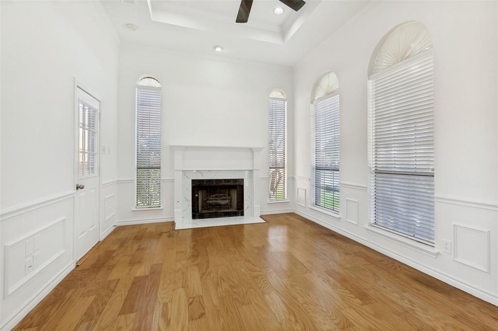 703 Rams Court Richardson, TX 75081 - Photo 3 of 23 Beautiful living area with gas FP and tray ceiling.