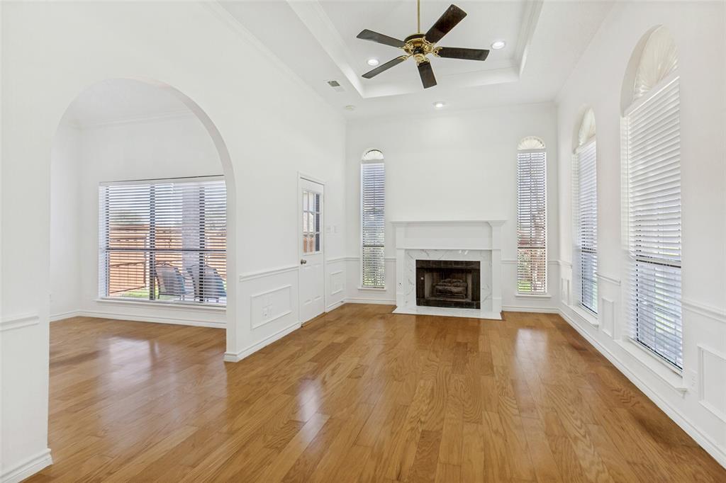 703 Rams Court Richardson, TX 75081 - Photo 4 of 23 Living area with archway to dining room.