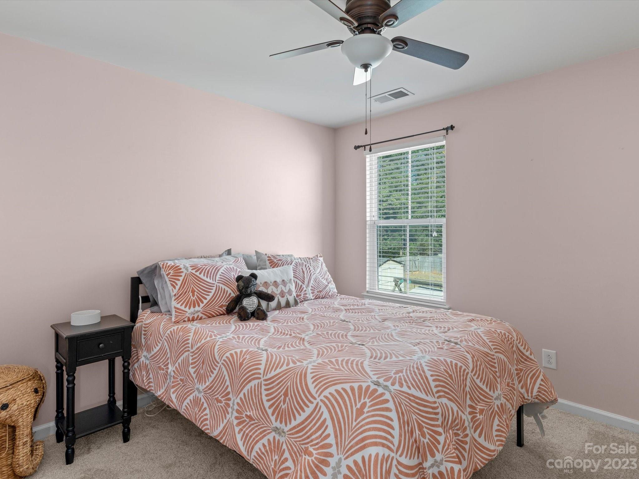7634 West Berkeley Road Denver, NC 28037 - Photo 17 of 25 a bedroom with a large bed and a window
