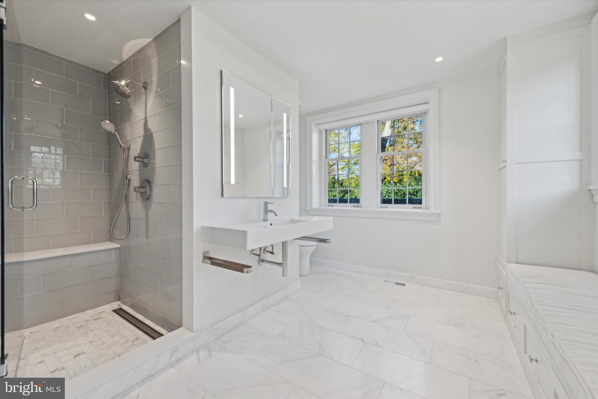 767-769 Newtown Road Villanova, PA 19085 - Photo 18 of 26 a bathroom with a bathtub and a shower