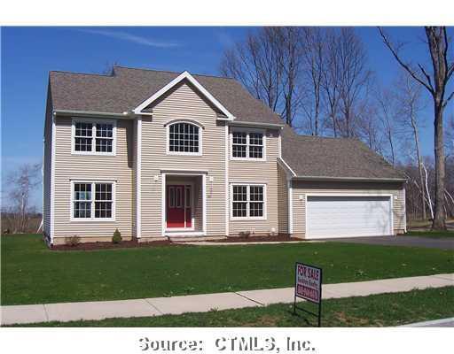 85 Round Hill Road Manchester, CT 06040 - Photo 1 of 1 a front view of a house with a yard and garage