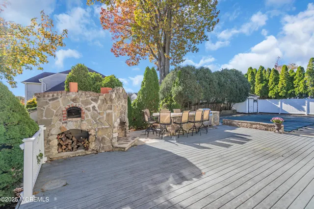 a view of a backyard with sitting area