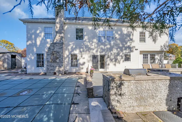a large building with a table and chairs