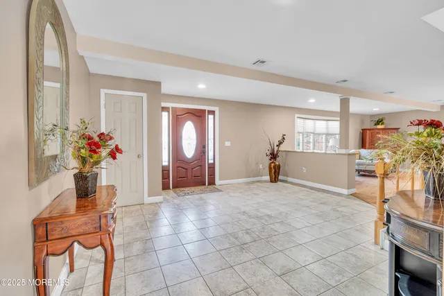 a living room with furniture and flowers