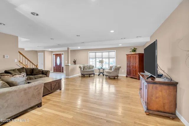 a living room with fireplace furniture and a flat screen tv