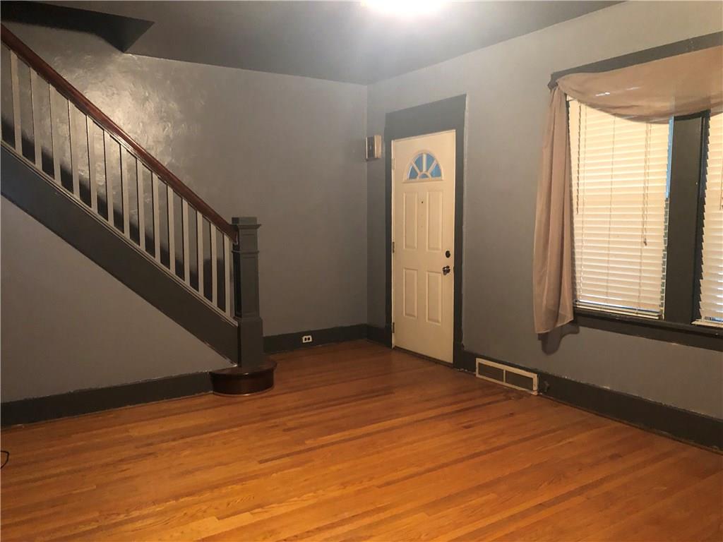 1224 Evergreen Road Pittsburgh, PA 15209 - Photo 5 of 20 Living room has lots of character... solid wood trim and original hardwood floors.