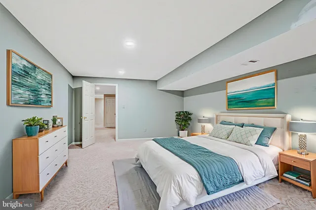 a bedroom with bed and windows