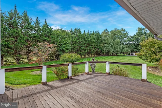 a view of a deck with sunset view