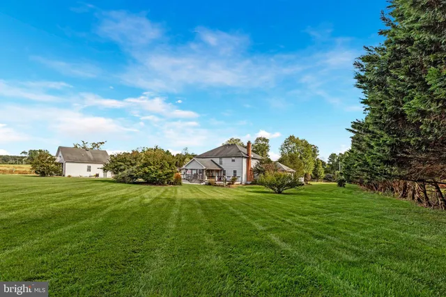 a view of a field with houses