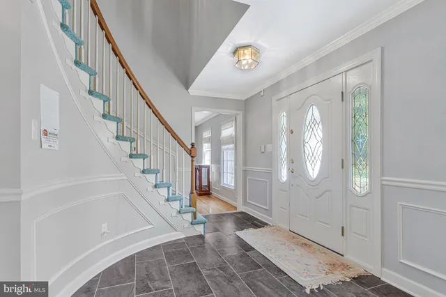 a view of entryway with wooden floor