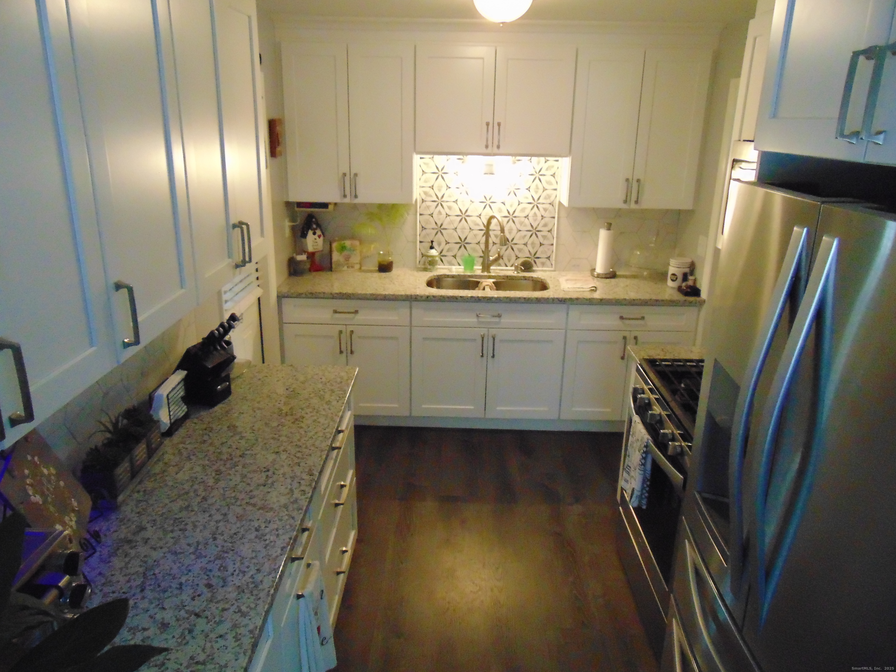 57 Alling Street Extension West Haven, CT 06516 - Photo 12 of 38 a kitchen with sink refrigerator and window