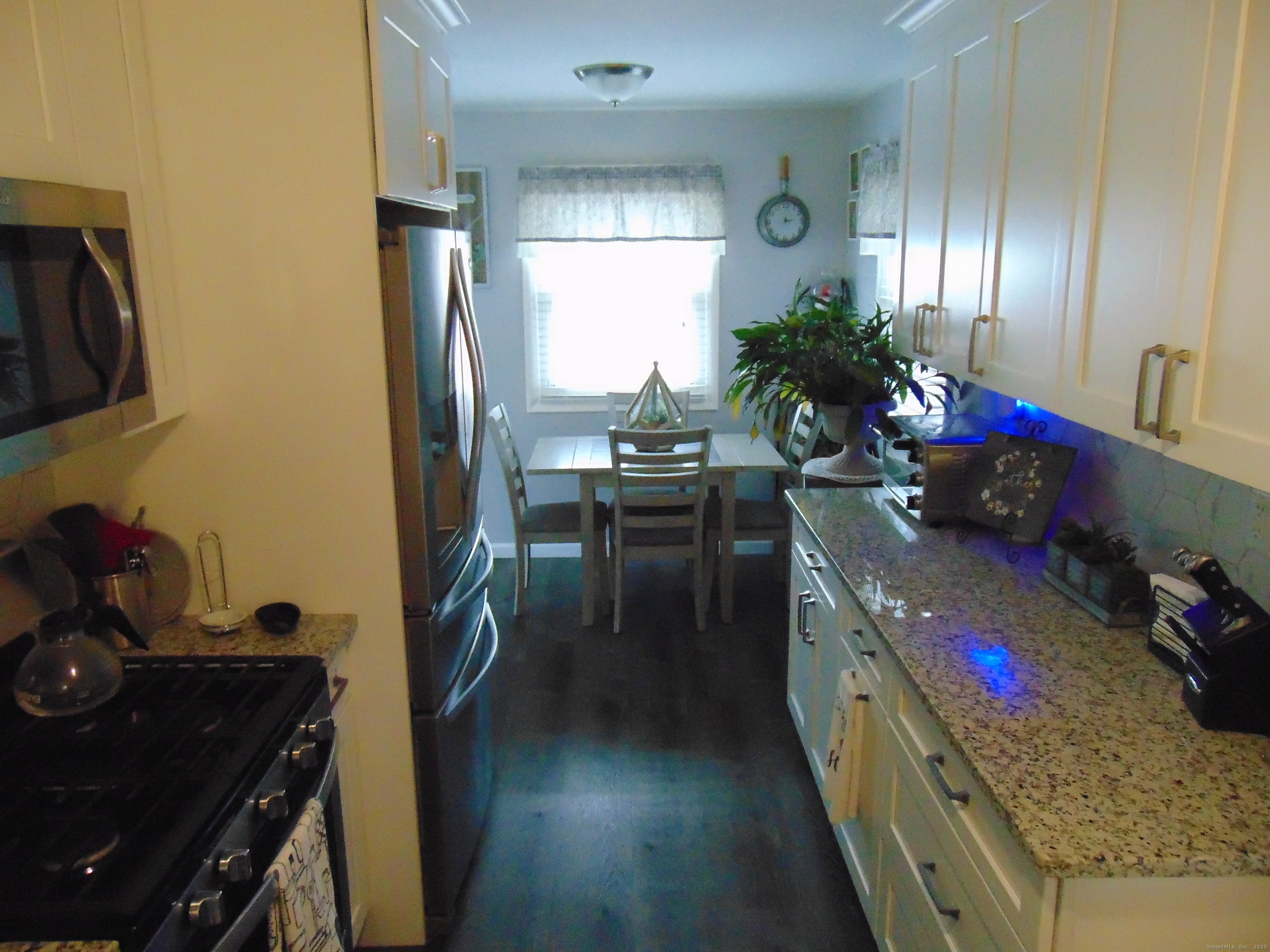 57 Alling Street Extension West Haven, CT 06516 - Photo 18 of 38 a kitchen with sink stove and cabinets