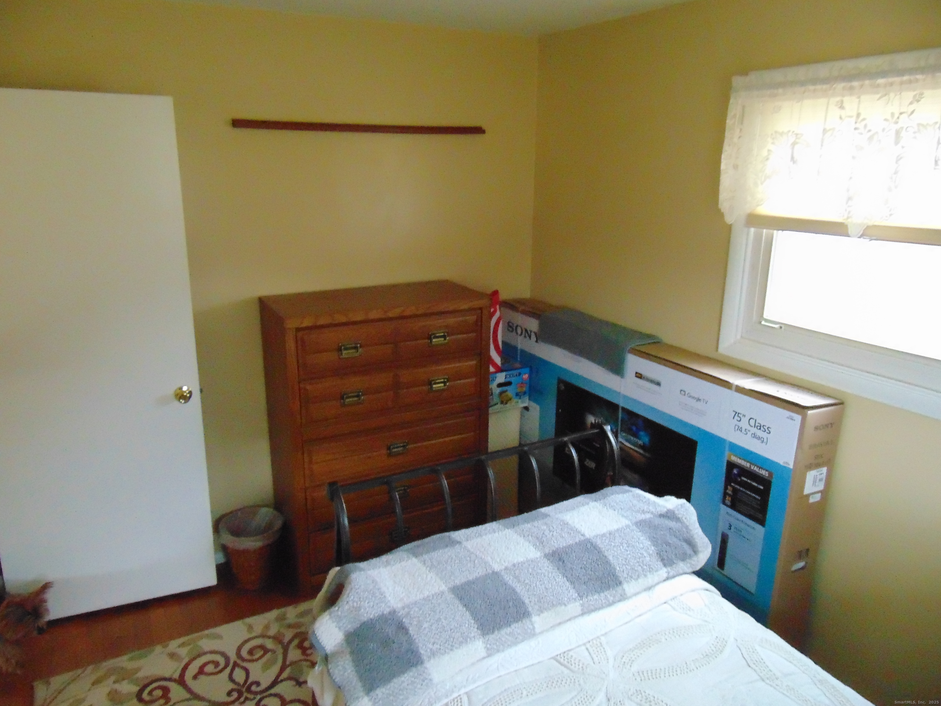 57 Alling Street Extension West Haven, CT 06516 - Photo 22 of 38 a bedroom with a bed and a window