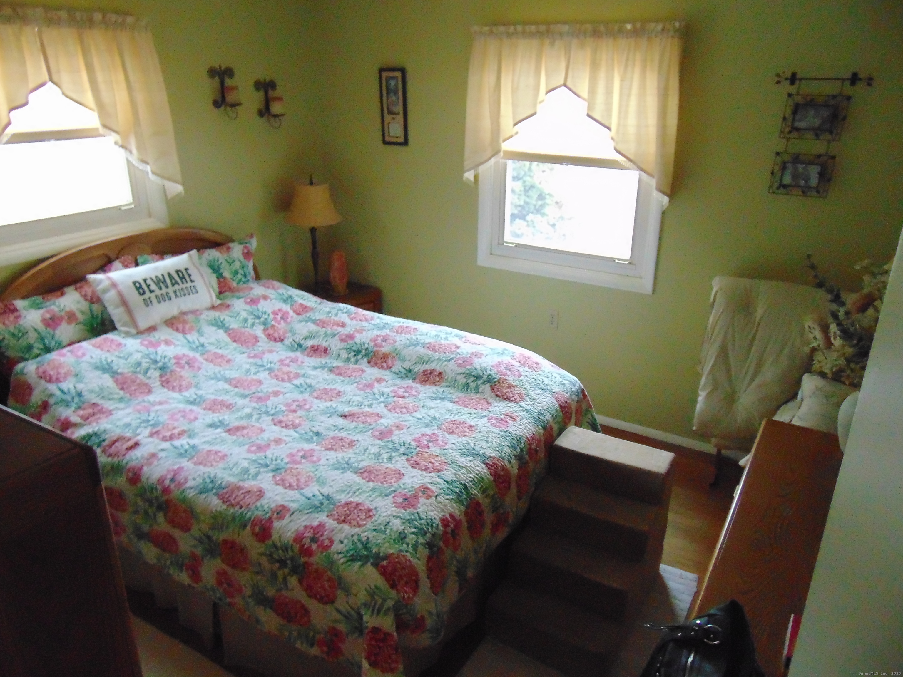 57 Alling Street Extension West Haven, CT 06516 - Photo 25 of 38 a bedroom with a bed and a window