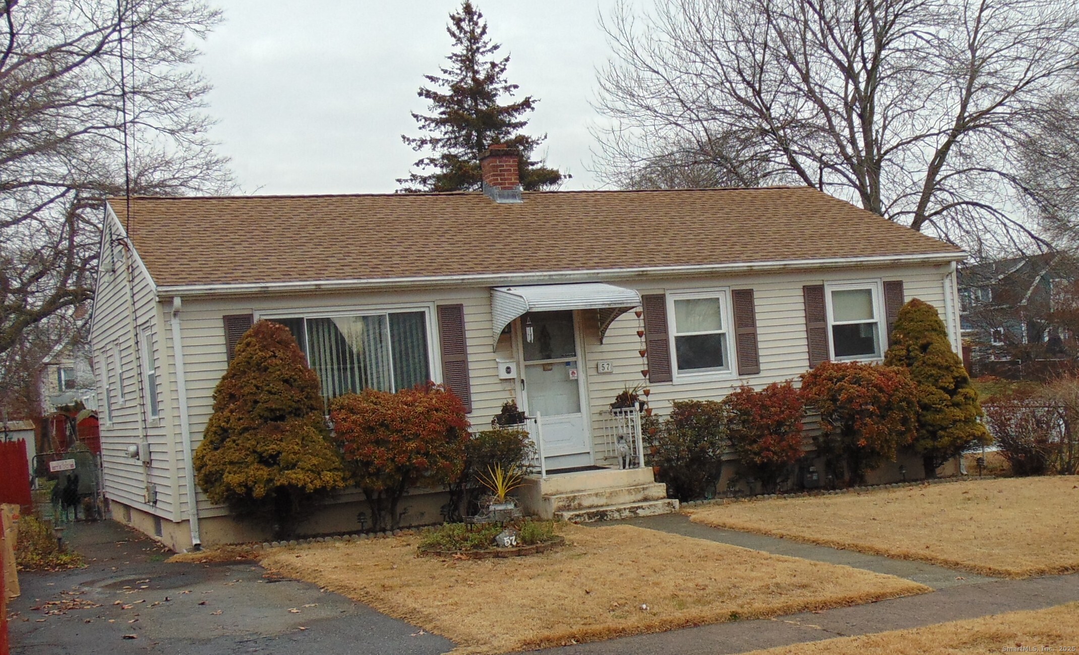 57 Alling Street Extension West Haven, CT 06516 - Photo 4 of 38 a front view of a house with garden