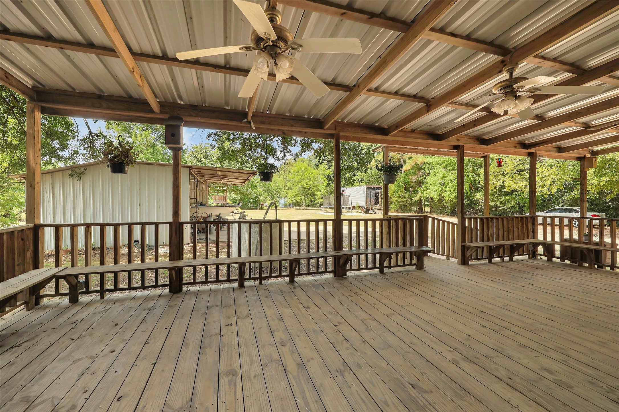 14945 Wiggins Road Conroe, TX 77302 - Photo 14 of 16 a view of a balcony with wooden floor