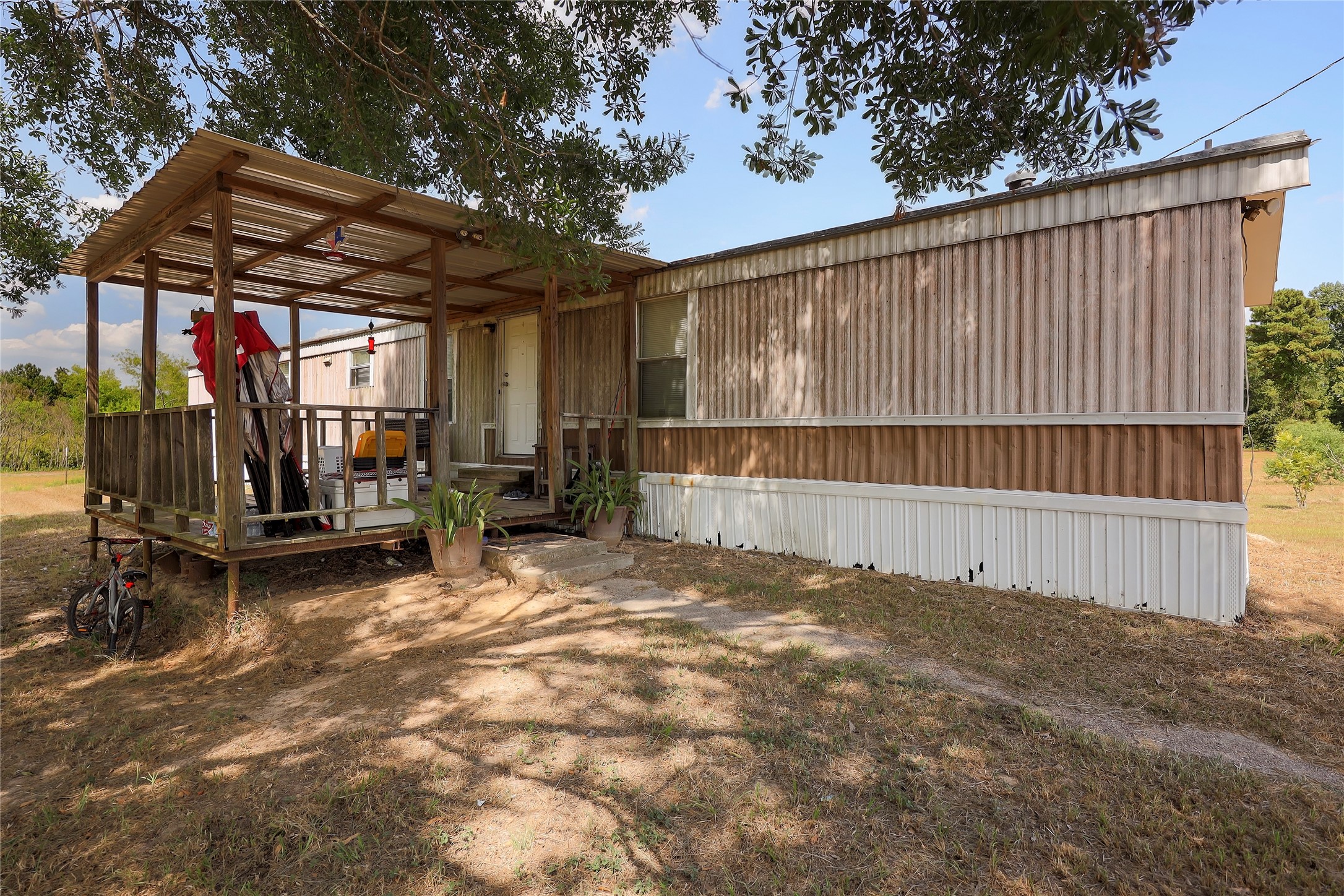 14945 Wiggins Road Conroe, TX 77302 - Photo 16 of 16 a view of outdoor space and deck