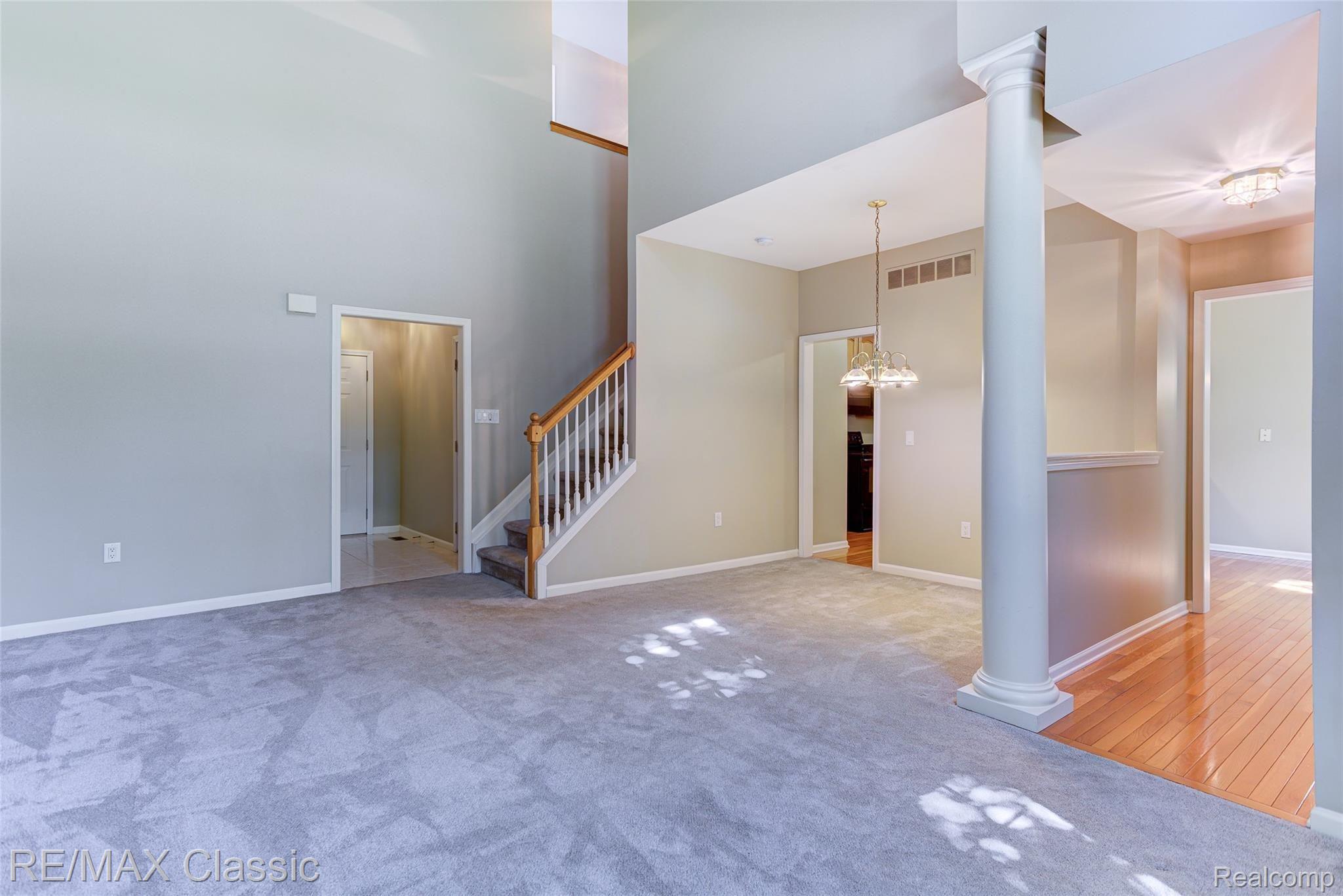 41620 Mitchell Road Novi, MI 48377 - Photo 12 of 40 From the front entry toward the great room spaces and the stairs