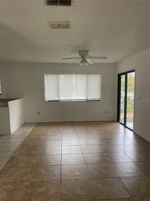 1015 Hickory Road Ocala, FL 34472 - Photo 4 of 14 a view of an empty room with a window