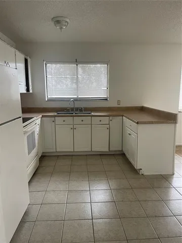 a kitchen with a cabinets window and counter space