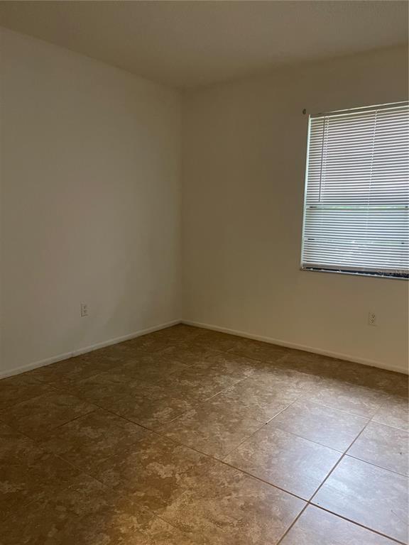 1015 Hickory Road Ocala, FL 34472 - Photo 8 of 14 an empty room with a window