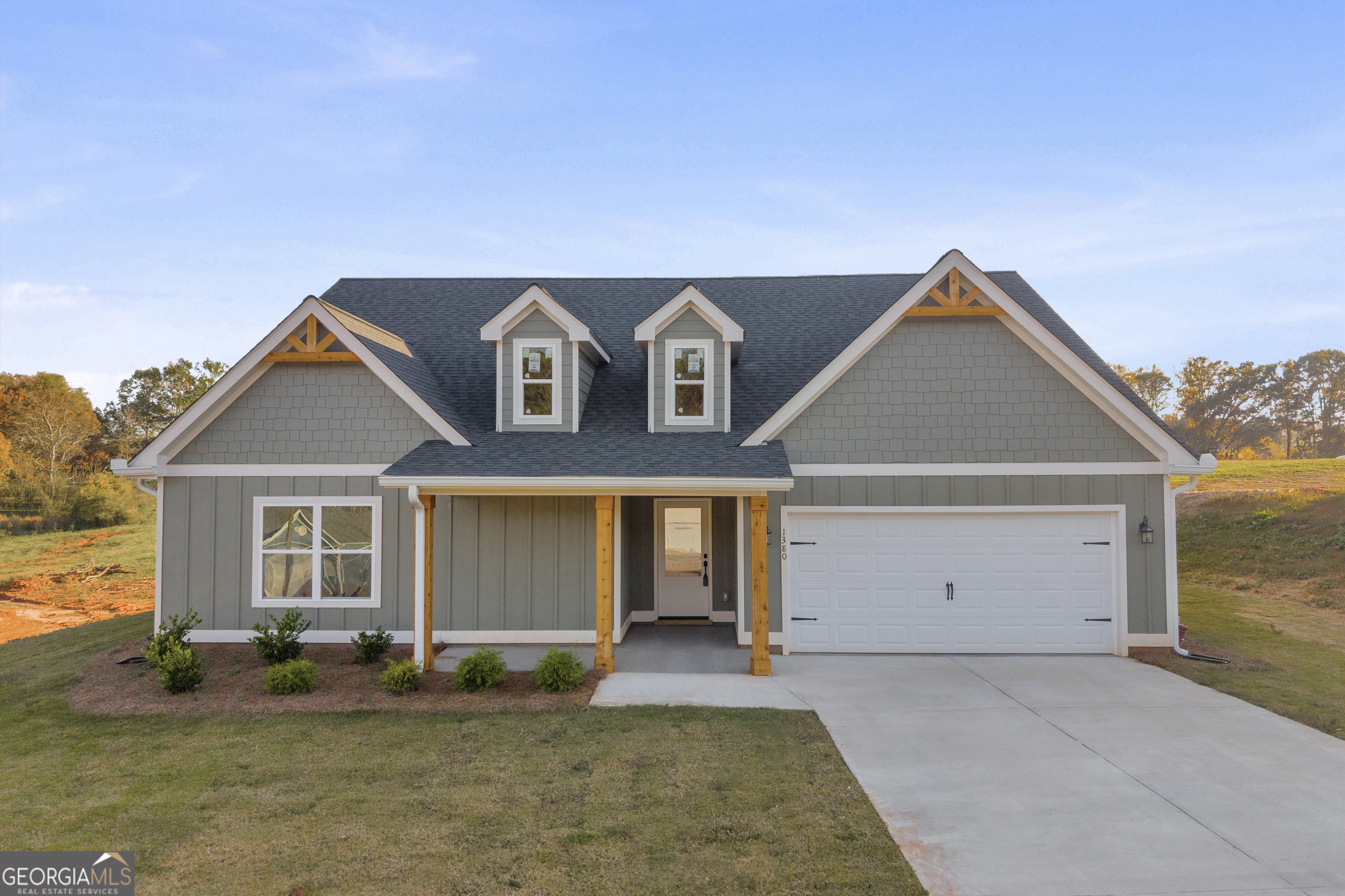 front view of a house with a yard
