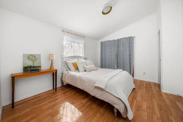 a bedroom with a bed and a dresser