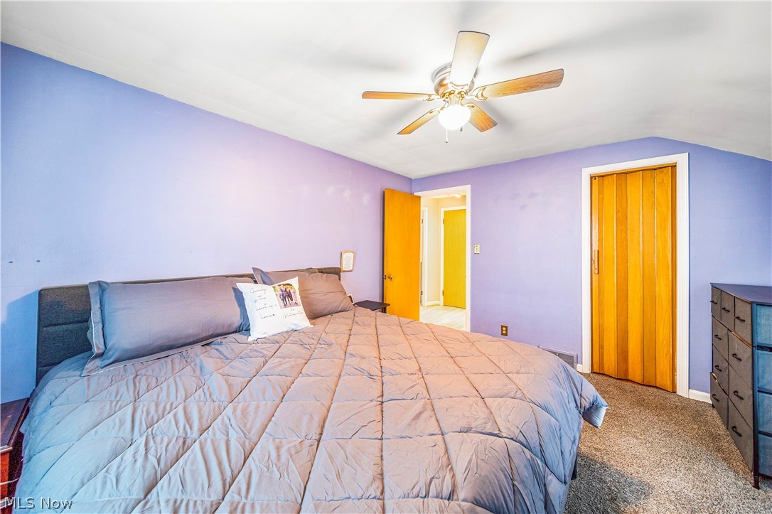 1588 Biltmore Road Cleveland, OH 44124 - Photo 8 of 43 Bedroom featuring light carpet, vaulted ceiling, and ceiling fan