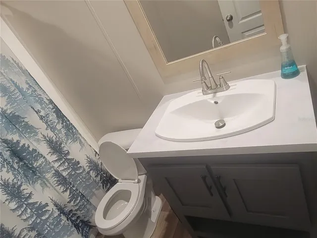 a bathroom with a sink and a toilet