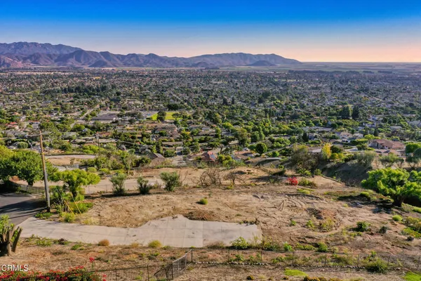 a view of a city with mountains in the background