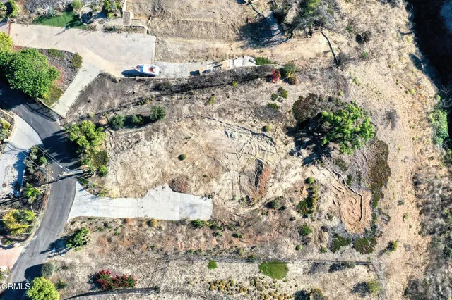 a view of a yard covered with snow