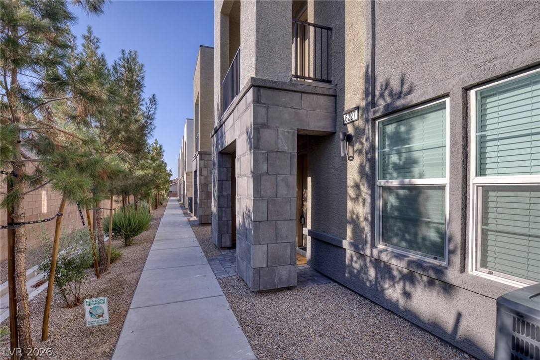 6227 Runestone Street Las Vegas, NV 89113 - Photo 30 of 33 This modern townhome features sleek architecture and a well-maintained exterior.