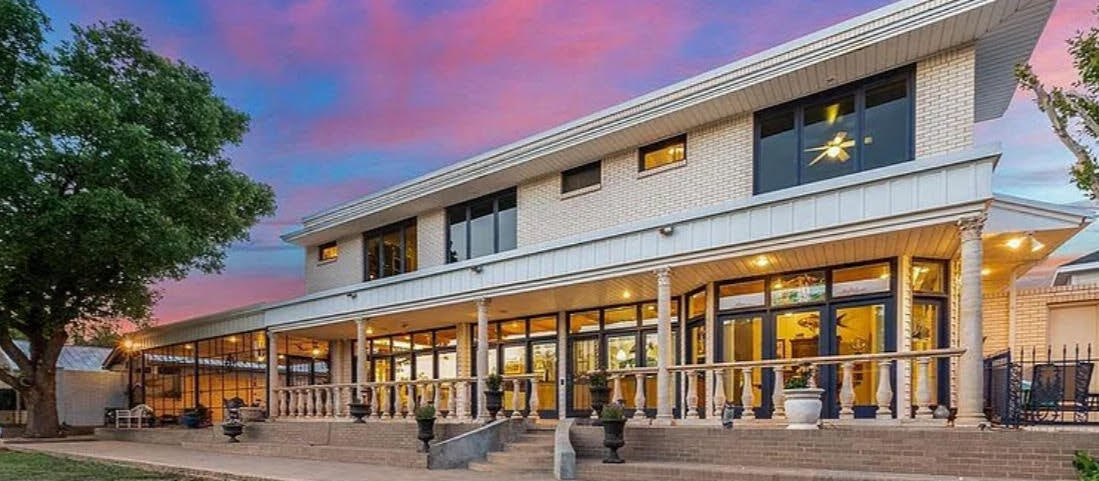 a front view of building with street