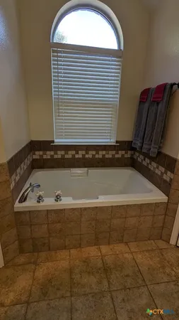 a view of a bathtub in a bathroom