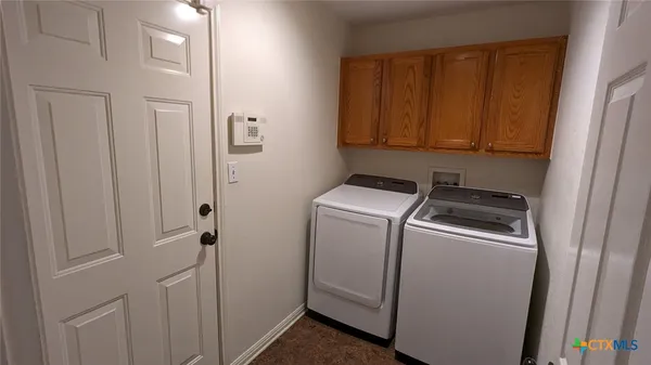 a utility room with dryer and washer
