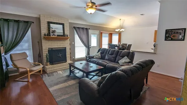 a living room with furniture and a fireplace