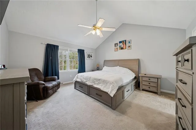 a view of a hallway with a livingroom and entryway