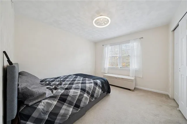 a view of a livingroom with furniture and a flat screen tv