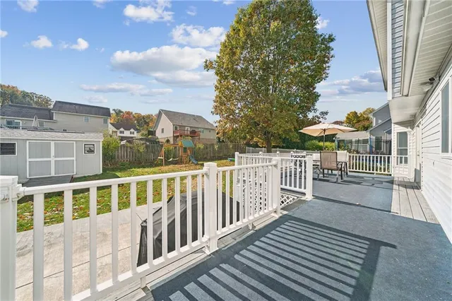 a view of a patio with table and chairs