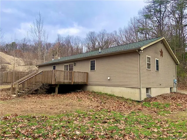 a backyard of a house with wooden fence