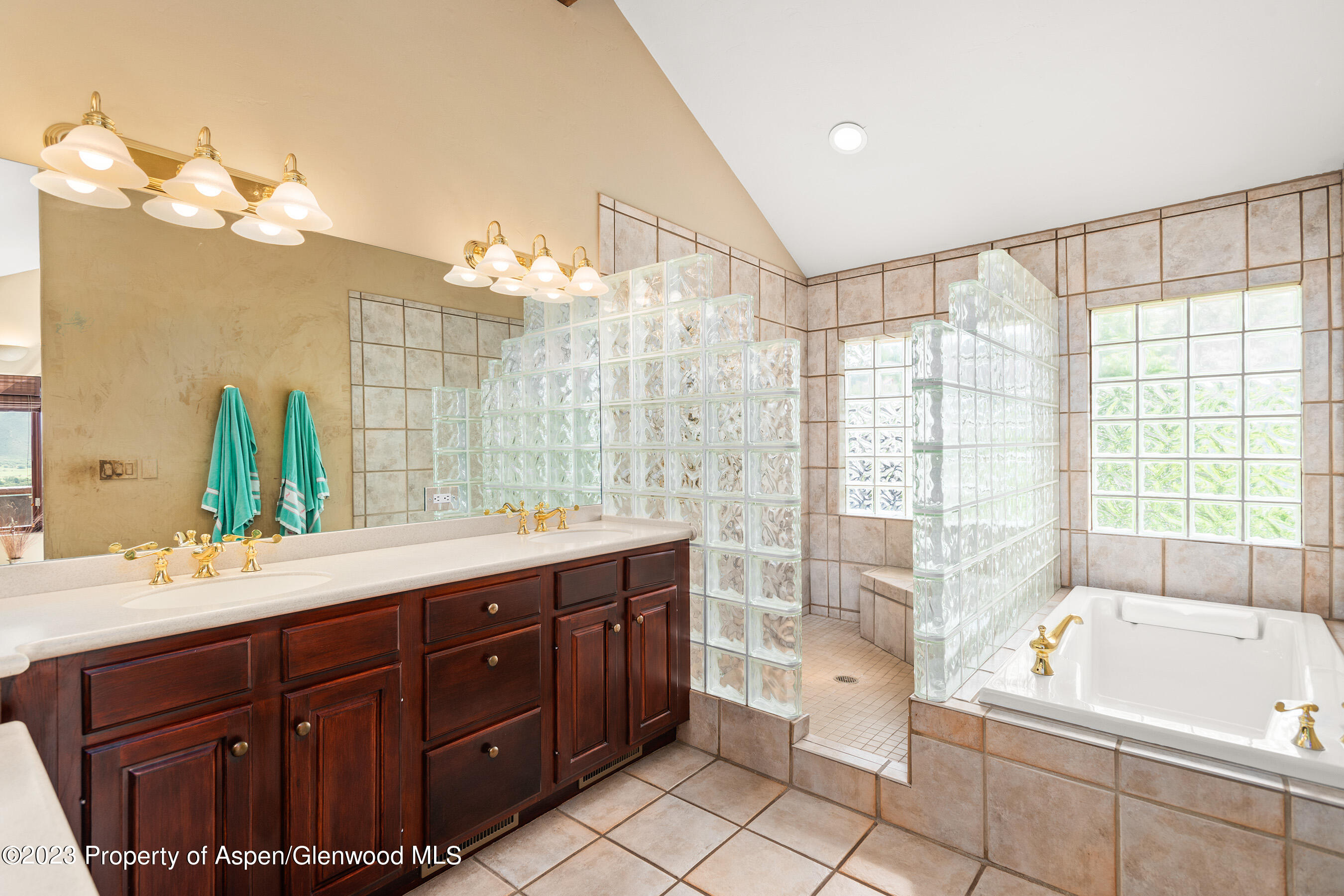 132 Ridge Road Basalt, CO 81621 - Photo 11 of 22 a spacious bathroom with a tub sink shower and mirror