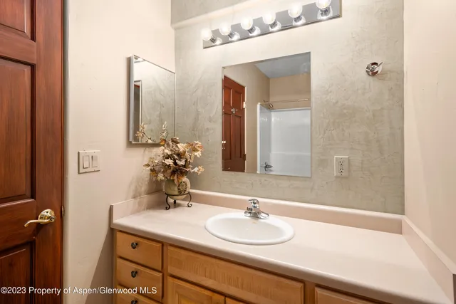 a bathroom with a sink and a mirror