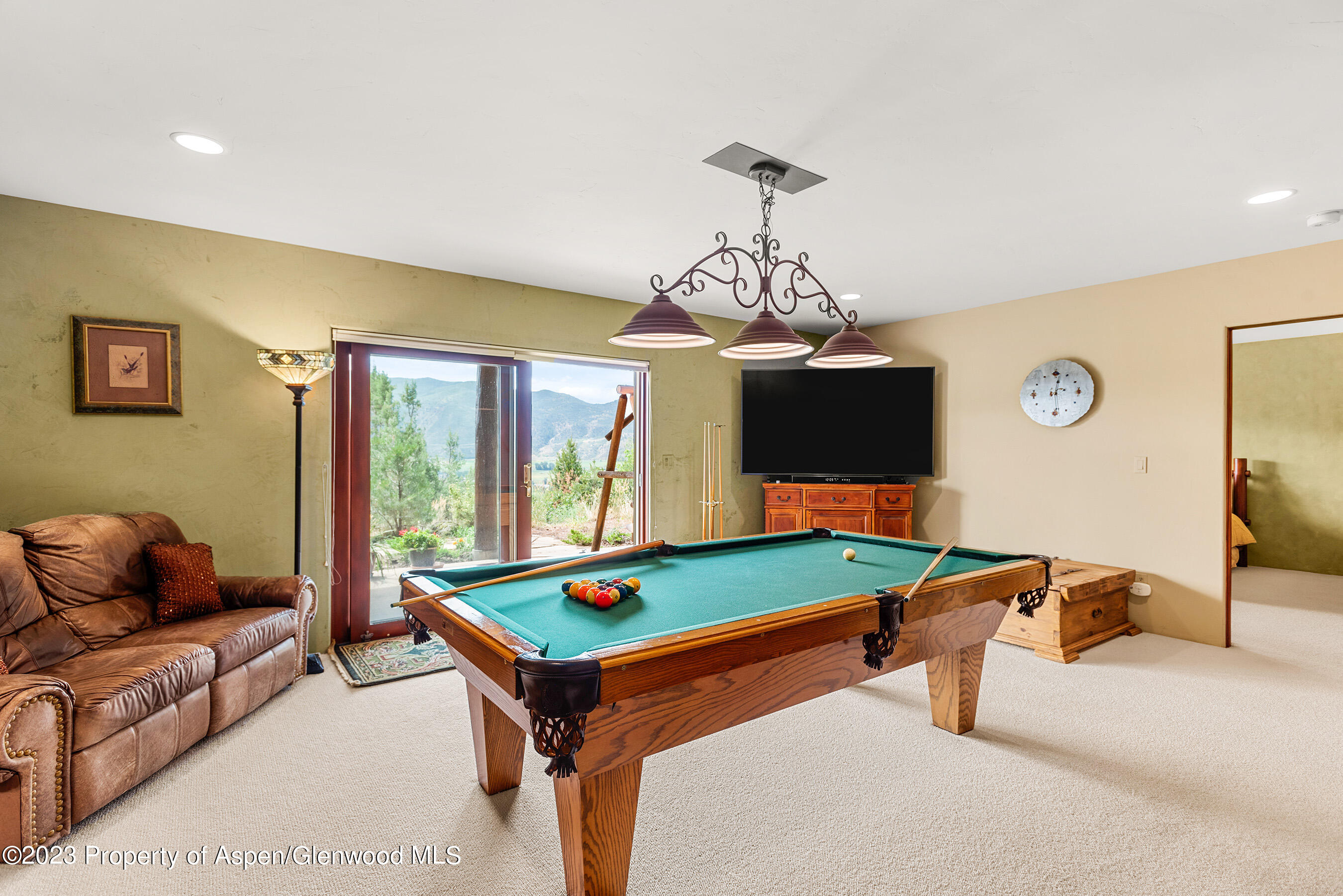 132 Ridge Road Basalt, CO 81621 - Photo 16 of 22 a living room with furniture and a flat screen tv